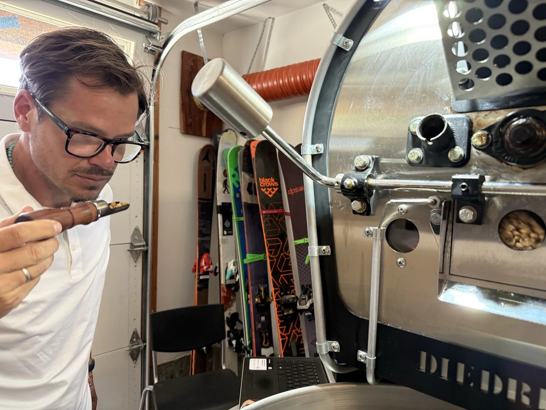 Mark, founder and roaster, checking a sample from the trier at the Diedrich roaster